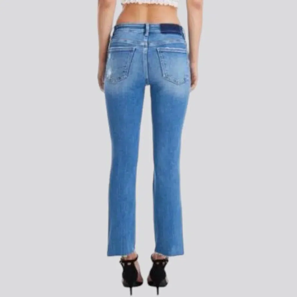 Distressed ankle-length jeans