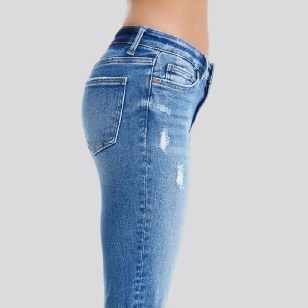 Distressed ankle-length jeans