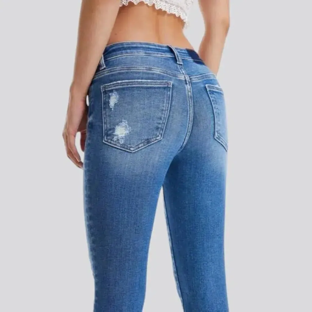 Distressed ankle-length jeans